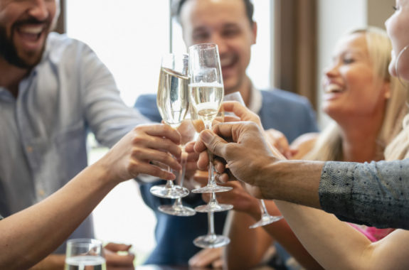 Cheerful friends toasting