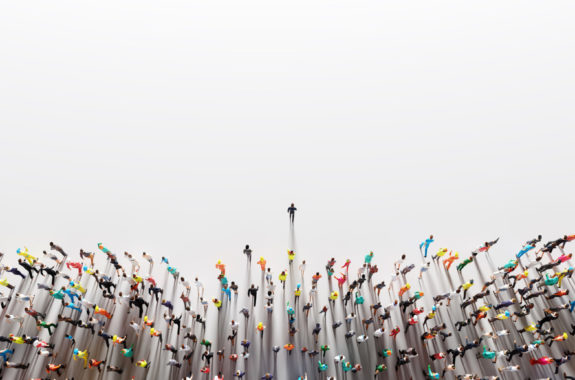 Businessman leader leading a large group of people.