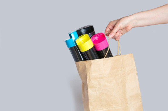 Female hand holds a paper bag