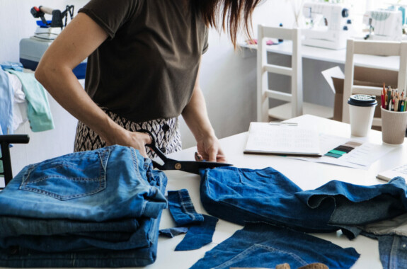 sewing and cutting jeans