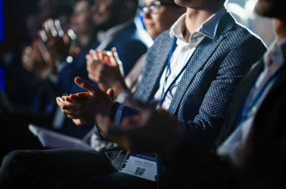 conference audience clapping hands