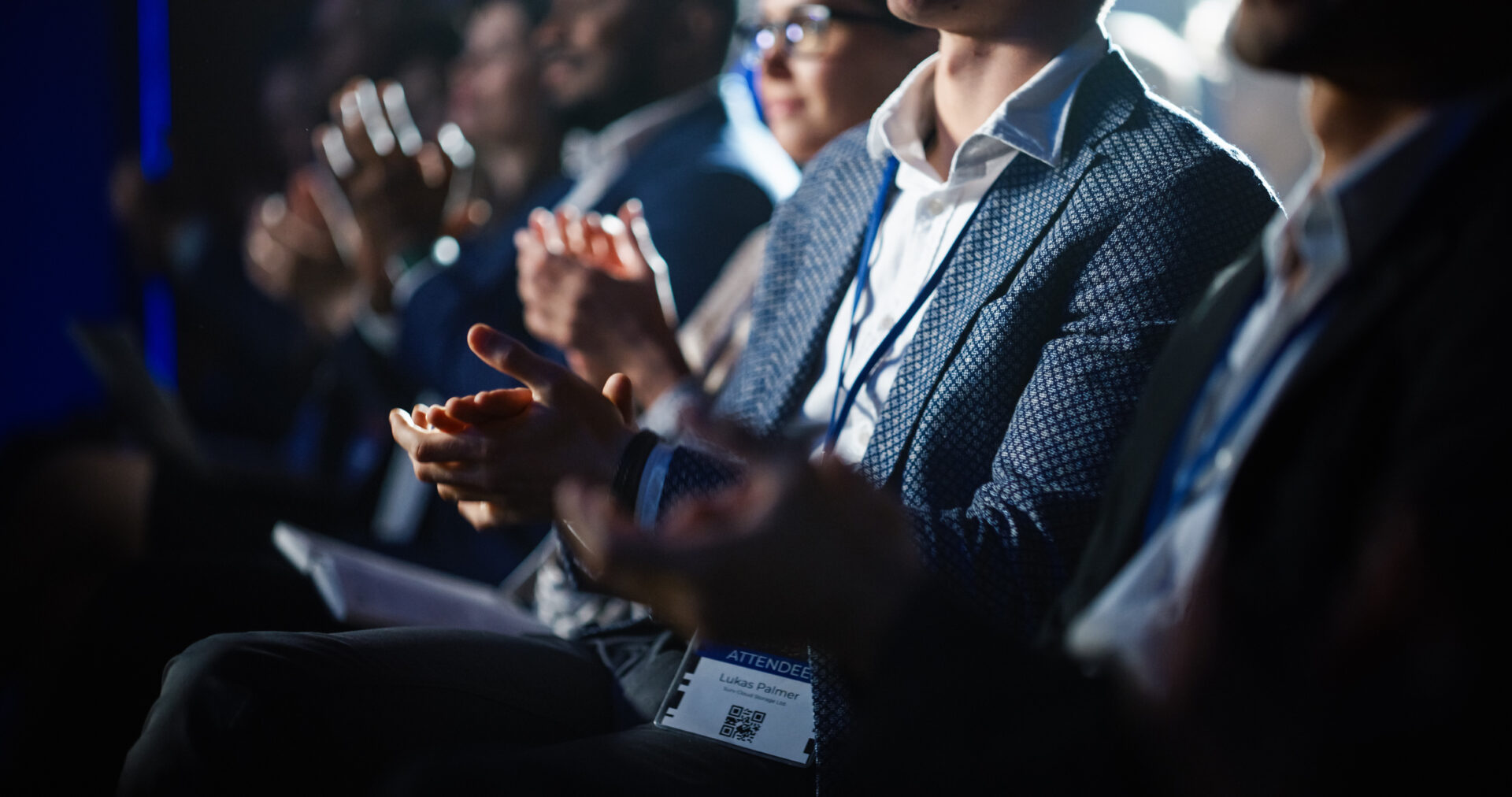 conference audience clapping hands